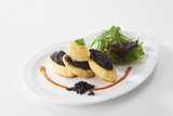 Recette : Quenelles natures grilles au beurre d'olives noires